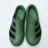 Green shoes with black stripes on a white background